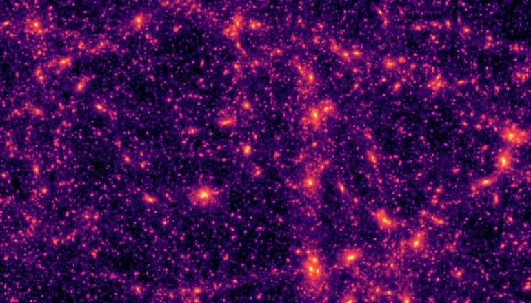 Patches of bright purple and red light representing dark matter show up on a black background