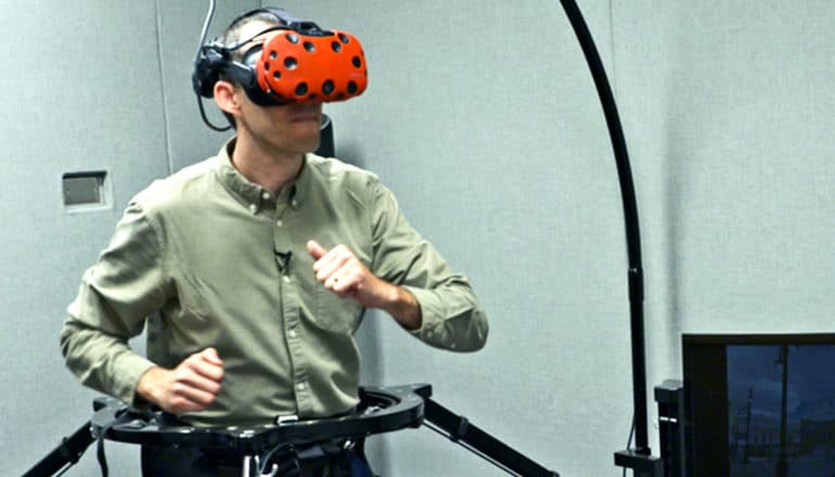Huffman runs on the treadmill while wearing a virtual reality headset