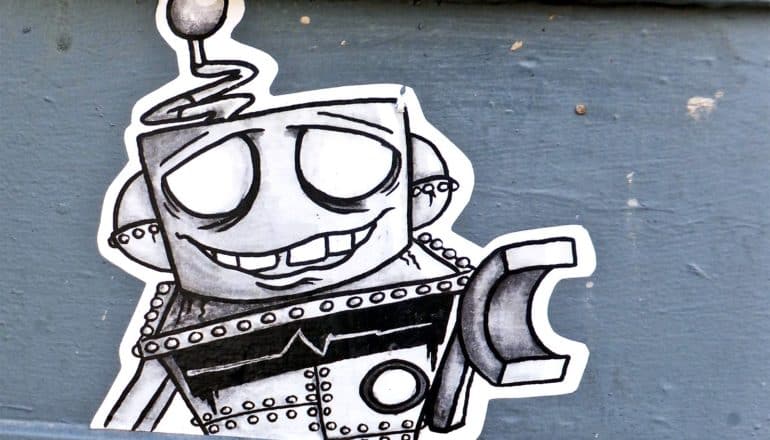 A sticker of a cartoonish robot looks like its apologizing for a mistake