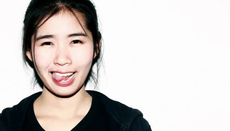 person sticks out tongue