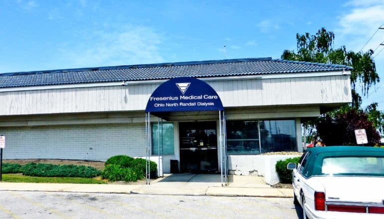 car outside building, awning reads "Fresenius Medical Care Ohio North Randall Dialysis"