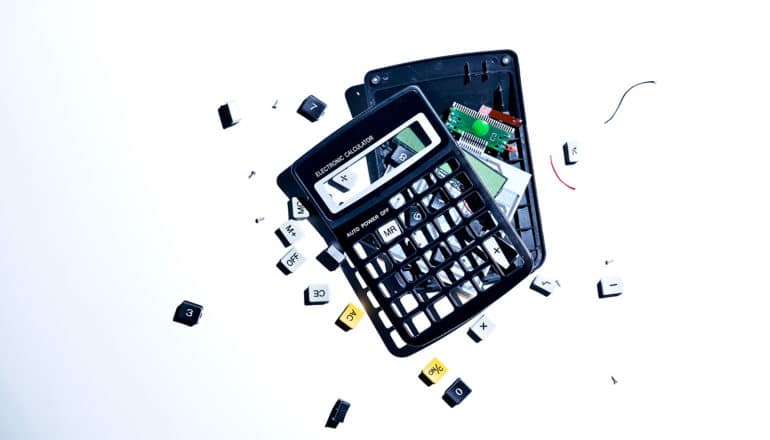 A smashed calculator on a white background