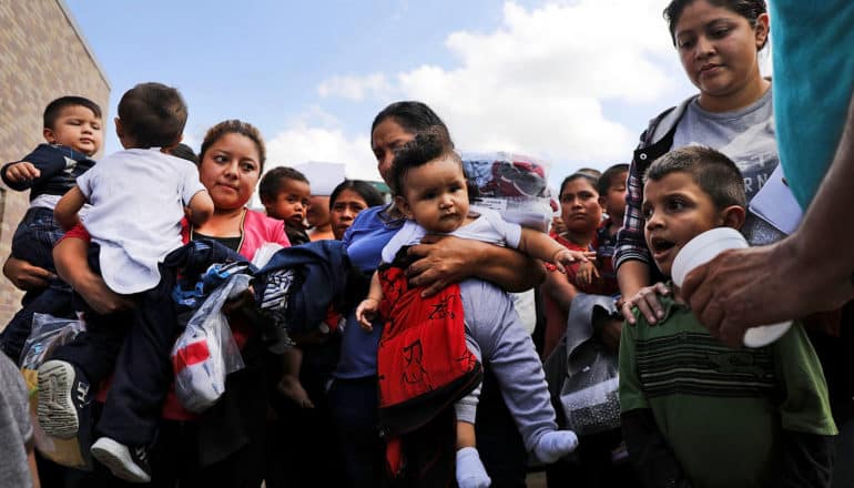 group of Central American women with children and babies