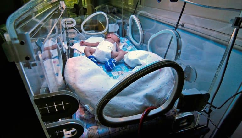 baby in incubator under light for jaundice
