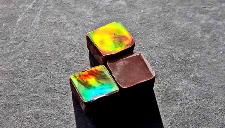 two out of three squares of chocolate shimmer with rainbow colors