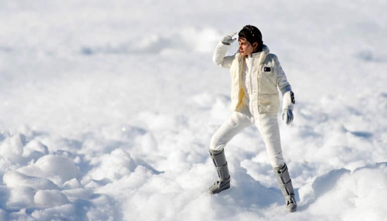 toy carrie fisher looks into the distance on snow