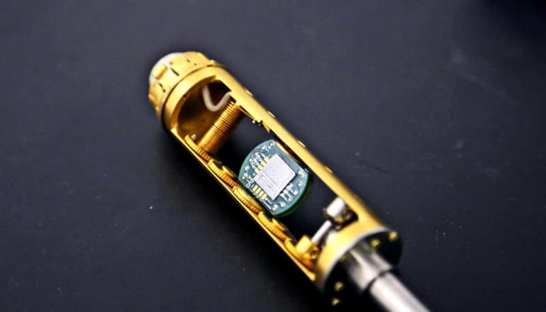 The device looks like a golden tube with a microchip within a hollowed space in its center