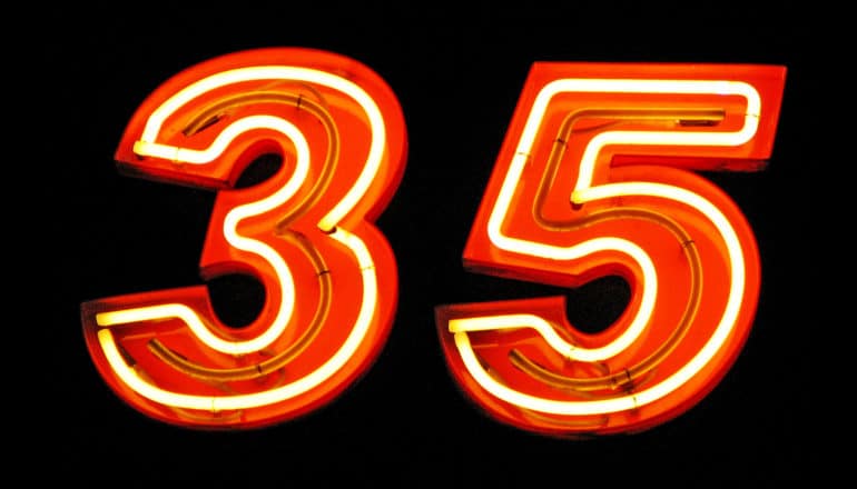 "35" in red neon lights on black