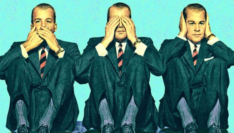 Three men in suits are seated one covering his mouth, the next covering his eyes, and the last covering his ears, acting out "Speak no evil. See no evil. Hear no evil."