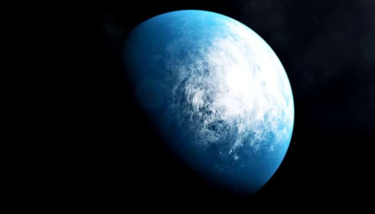 The planet appears blue and white against the blackness of space