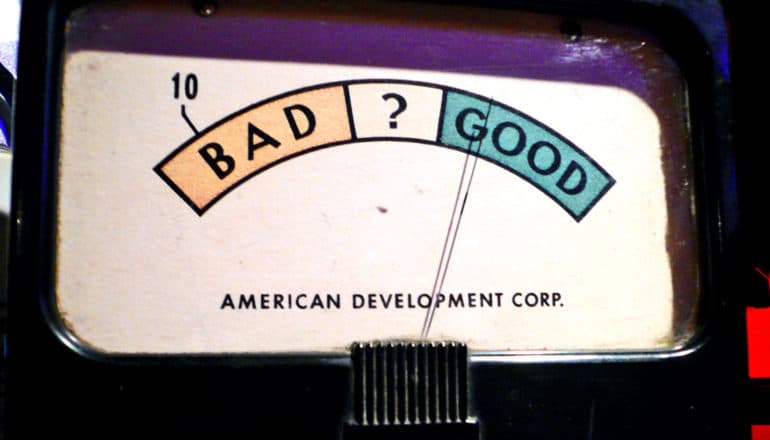 A old machine has a meter that flips between good (highlighted in green) and bad (highlighted in red)