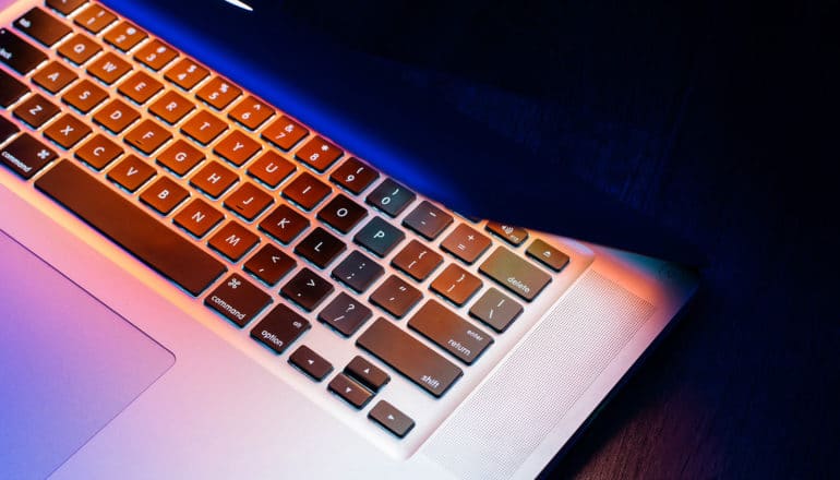 light of laptop screen on keys