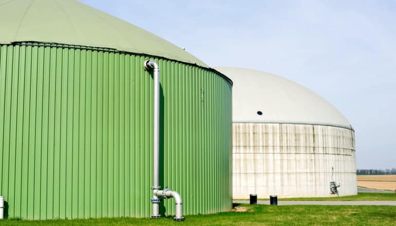 green and white anaerobic digesters