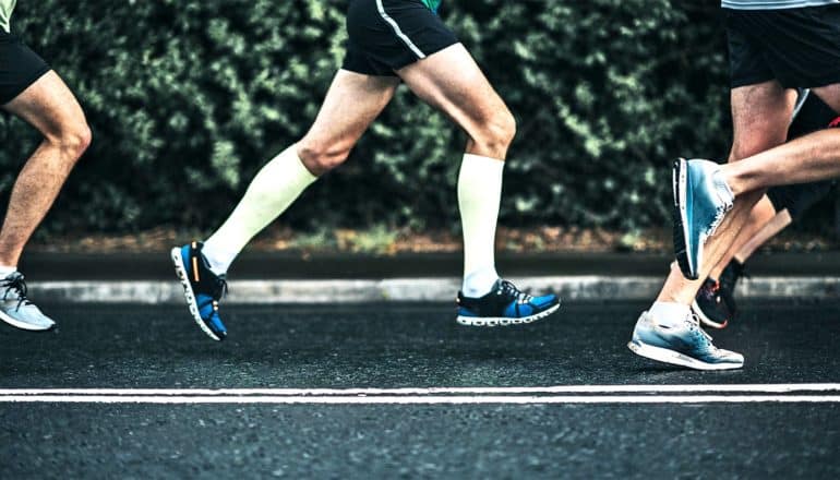 legs of a group of runners of ultramarathoners