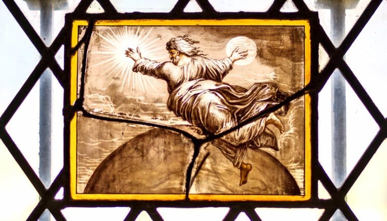 image on glass of God as floating older white man in robes