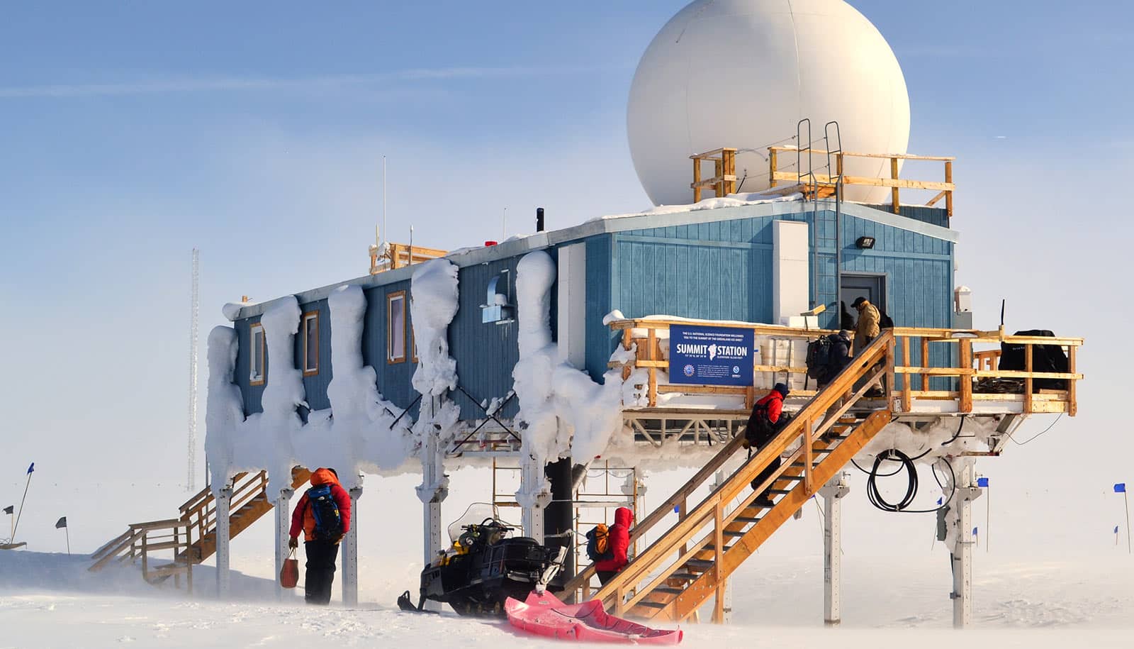 prefab building on stilts in frozen landscape