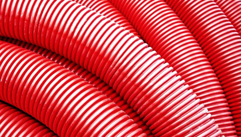 Red plastic piping overlaps
