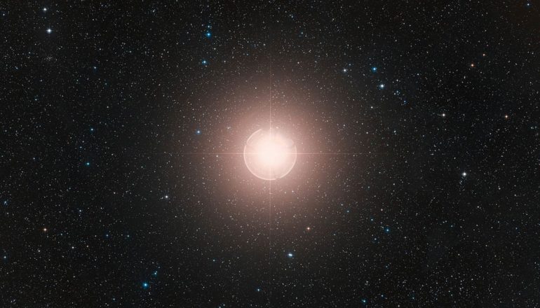 larger bright star in field of smaller ones