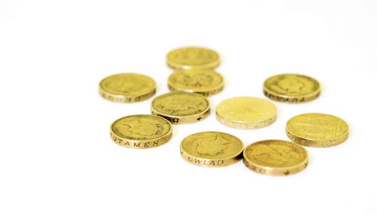 1-pound coins on white