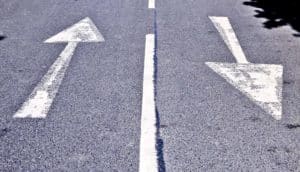 road arrows in opposite directions