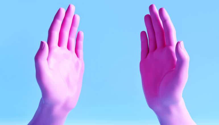 fake pink hands held up as if about to touch your face