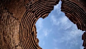 sky through jagged hole in stone structure