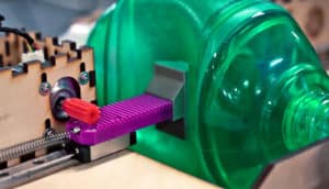 plastic gear turns to move notched plank that squeezes plastic "lung"