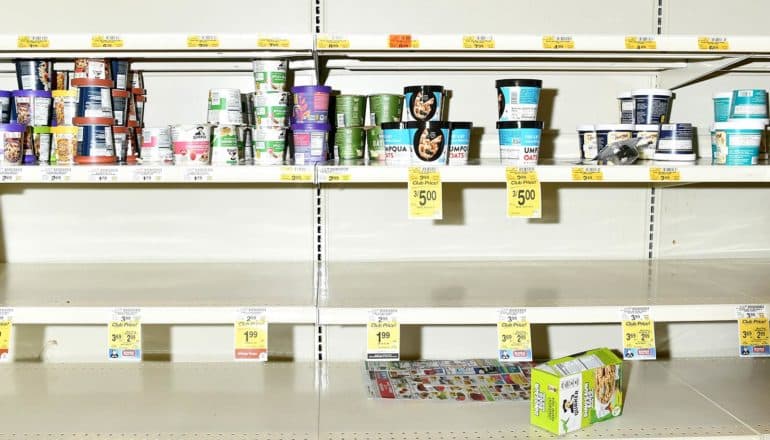 single-serve oatmeal canisters on mostly empty shelves