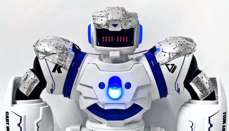 A robot has foil-like batteries molded to its head and shoulders