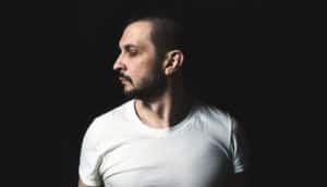 serious man looks to the side