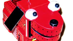 A red toy robot dog on a white background