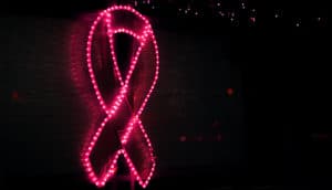 Pink lights form the shape of a pink ribbon