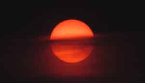 cloud in front of red sun