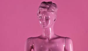 female-looking mannequin covered in pink paint