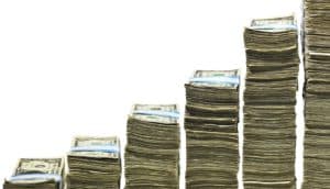 Increasing large stacks of money