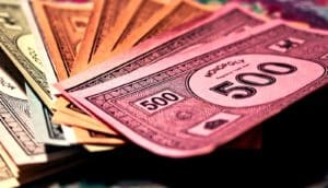 Differently colored paper money from the game Monopoly