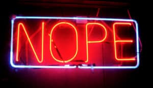 neon sign says "nope"