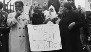 "free legal abortion" sign at protest