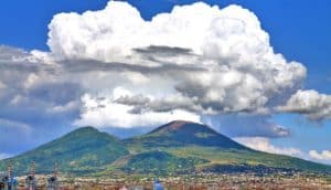 Mount Vesuvius with white clouds above its peak