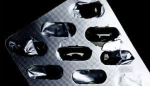 An empty silvery blister pack that once held prescription pills