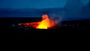 Smoke glows red as it rises from the Kilauea volcano caldera.