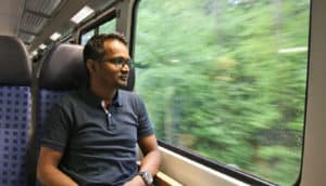 train passenger looks out window