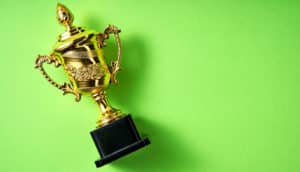 gold trophy on green background