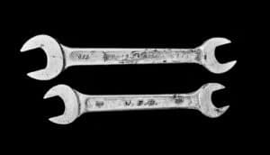 two wrenches on black background