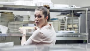person looks afraid while working in restaurant