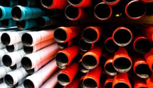 Red, white, and blue pipes stacked together.