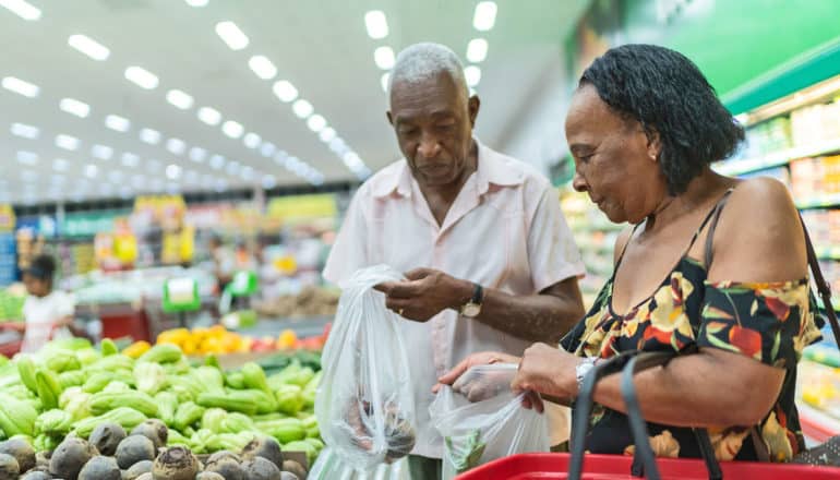 two older adults at grocery store