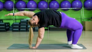 fat person does inverted yoga pose