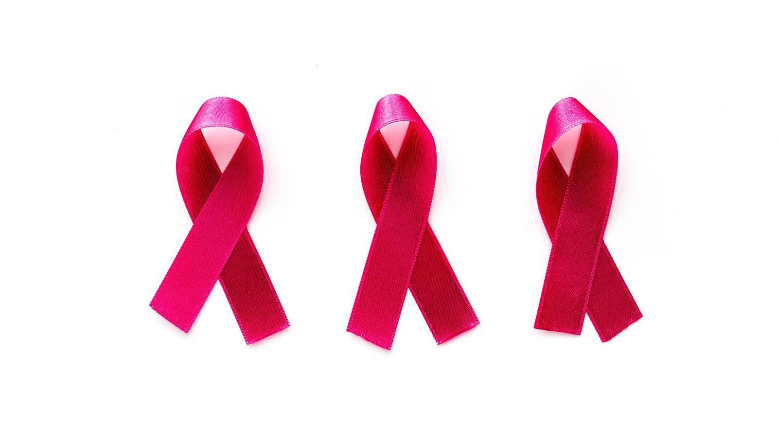 Three pink ribbons on a white background.