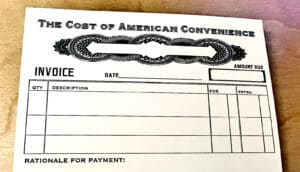 postcard has "the cost of american convenience" above invoice with item lines and "rationale for payment" below